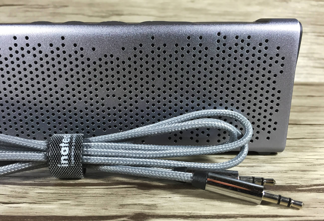 Inateck BP2101 audio cable and front of the bluetooth speaker