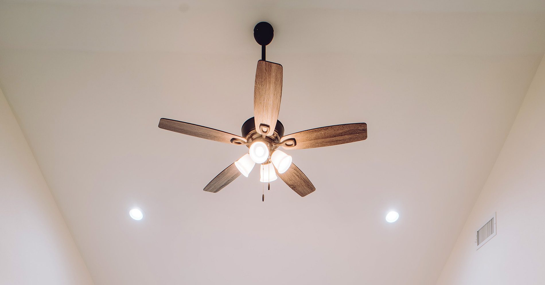 Combining the fan with the lighting is a good idea if you don't want to completely redo the power wiring.