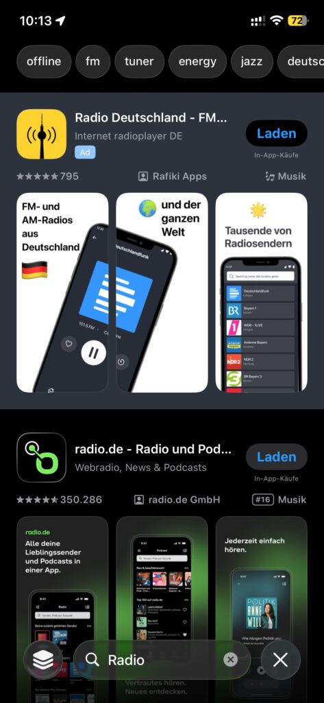Screenshot vom aktuellen iOS 26.2 im Dunkelmodus. Die Werbeanzeige vor den tatsächlichen Suchergebnissen ist noch am Hintergrund erkennbar. Bald vielleicht nur noch am "Ad"-Hinweis.